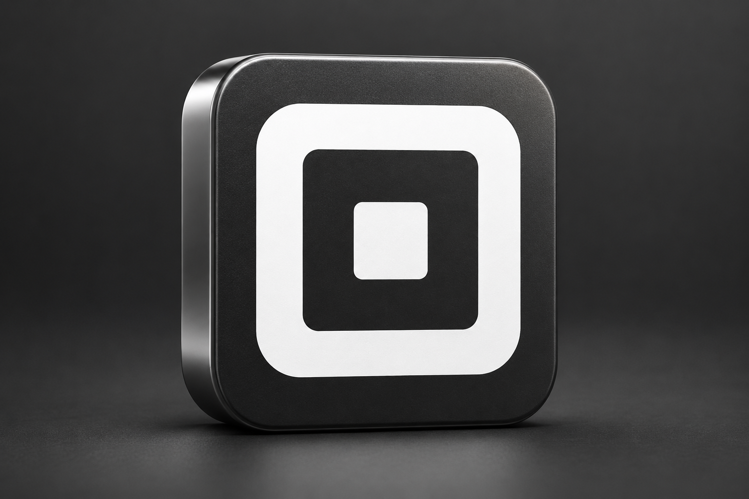 3D editorial render of the verified current Square app icon on a charcoal background; illustration for a historical article.